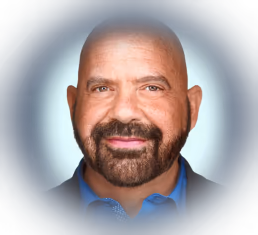 Portrait of Stephen Gilfus on a deep navy background with a soft halo